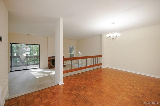 11808 N Briar Patch Dr, Midlothian, VA 22313 - empty room with a chandelier and a brick fireplace