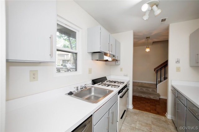 11808 N Briar Patch Dr, Midlothian, VA 22313 - kitchen featuring white range with gas stovetop, under cabinet range hood, light countertops, and gray cabinetry