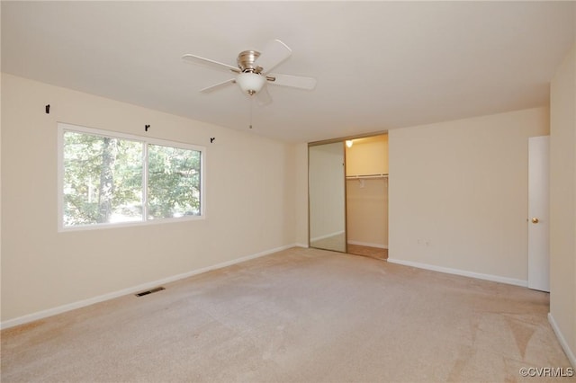 11808 N Briar Patch Dr, Midlothian, VA 22313 - unfurnished bedroom featuring light colored carpet, a closet, and a ceiling fan