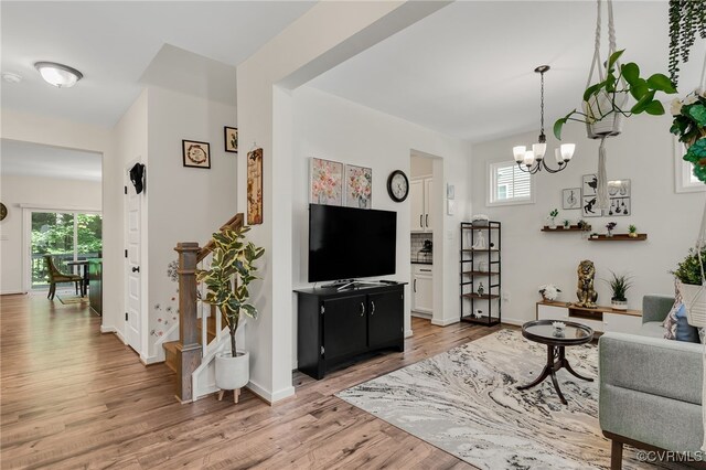 6112 Water Violet Ter, Moseley, VA 23120 - living area with light wood-style flooring and a chandelier