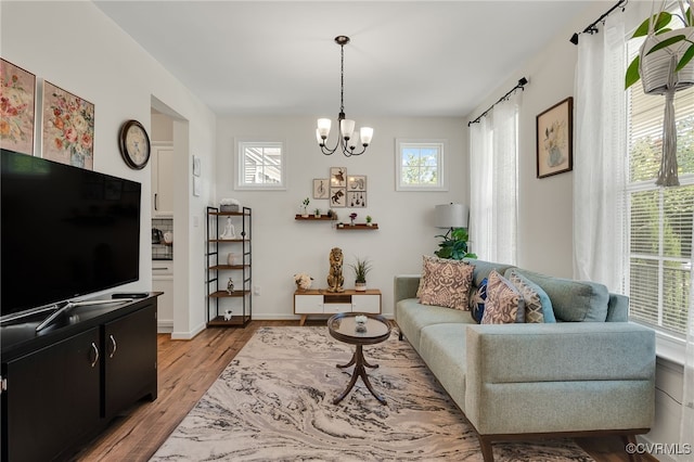 6112 Water Violet Ter, Moseley, VA 23120 - living room featuring a chandelier and light wood-style flooring
