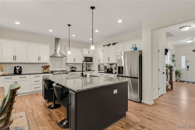6112 Water Violet Ter, Moseley, VA 23120 - kitchen with stainless steel fridge with ice dispenser, wall chimney exhaust hood, built in microwave, light wood-style flooring, and recessed lighting