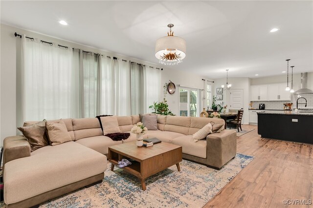 6112 Water Violet Ter, Moseley, VA 23120 - living room with a chandelier, light wood-style flooring, and recessed lighting