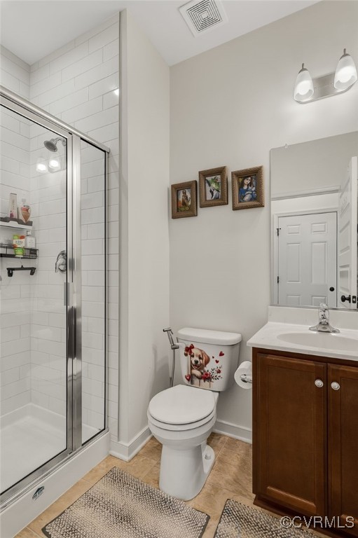 6112 Water Violet Ter, Moseley, VA 23120 - bathroom featuring vanity, a shower stall, and tile patterned floors