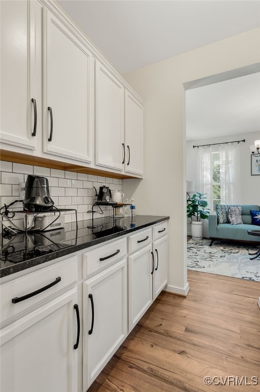 6112 Water Violet Ter, Moseley, VA 23120 - bar with light wood finished floors and tasteful backsplash