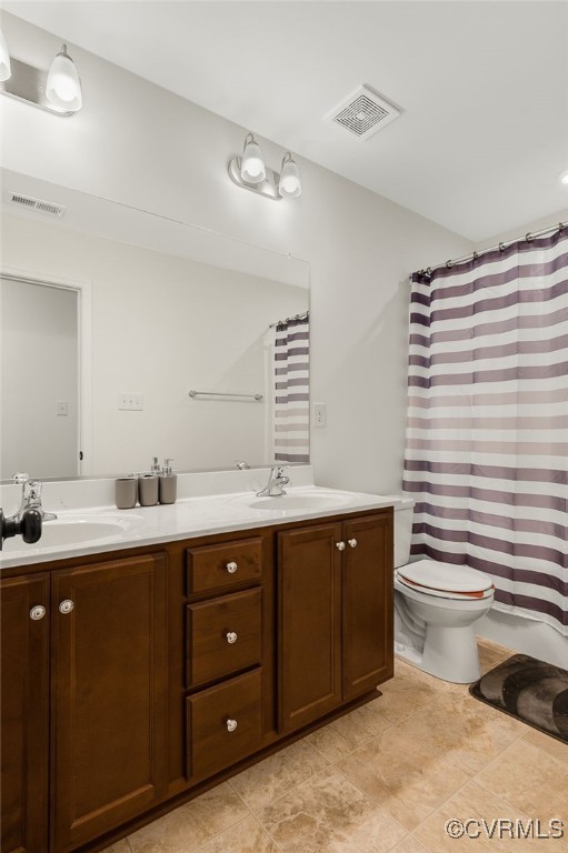 6112 Water Violet Ter, Moseley, VA 23120 - bathroom with double vanity and a shower with curtain
