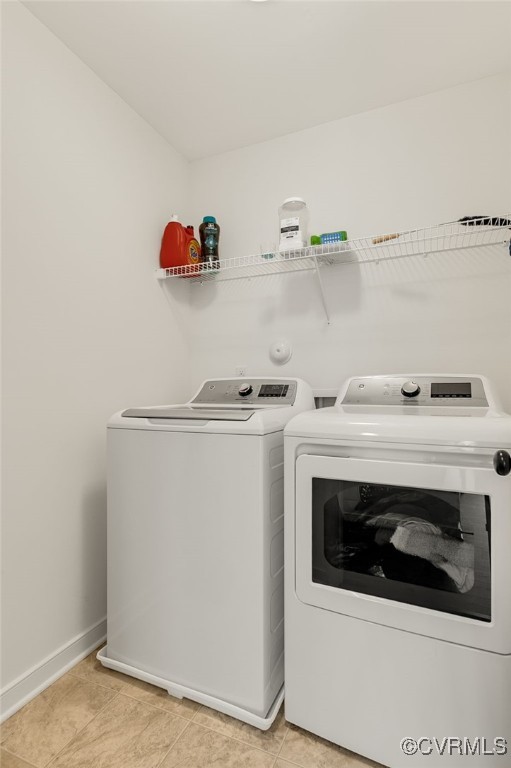 6112 Water Violet Ter, Moseley, VA 23120 - washroom featuring washing machine and clothes dryer and light tile patterned floors