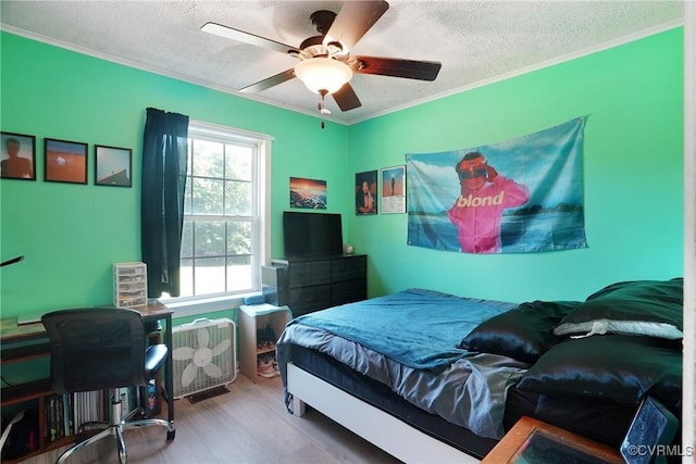 291 Briery Hills Dr, Meherrin, VA 23954 - bedroom with a textured ceiling, ornamental molding, ceiling fan, and wood finished floors