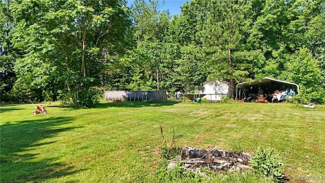 291 Briery Hills Dr, Meherrin, VA 23954 - view of grassy yard featuring a carport and an outdoor structure