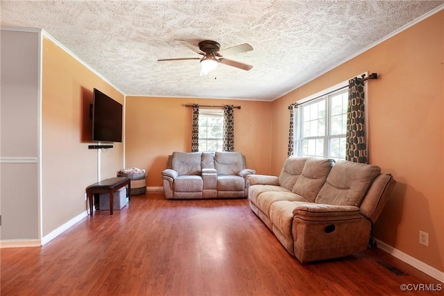 291 Briery Hills Dr, Meherrin, VA 23954 - living area featuring ceiling fan, a textured ceiling, wood finished floors, and ornamental molding