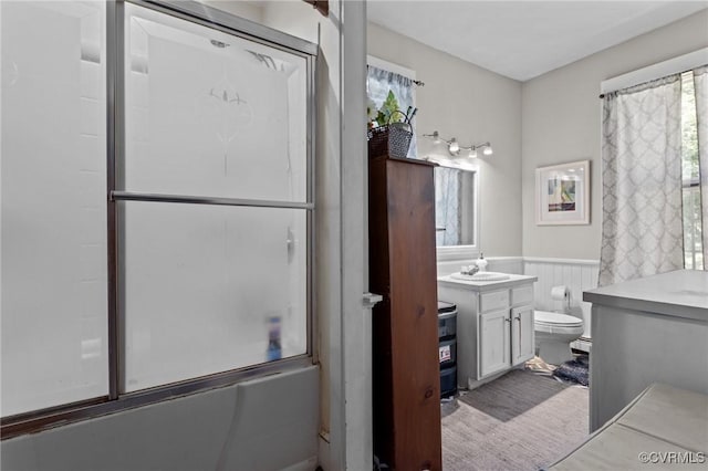 306 Hamilton Ave, Colonial Heights, VA 23834 - bathroom with combined bath / shower with glass door, vanity, wainscoting, and a baseboard radiator