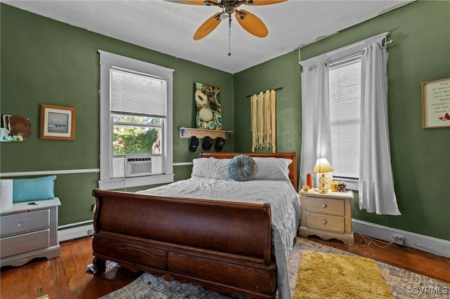 306 Hamilton Ave, Colonial Heights, VA 23834 - bedroom with a baseboard radiator, cooling unit, wood-type flooring, and ceiling fan