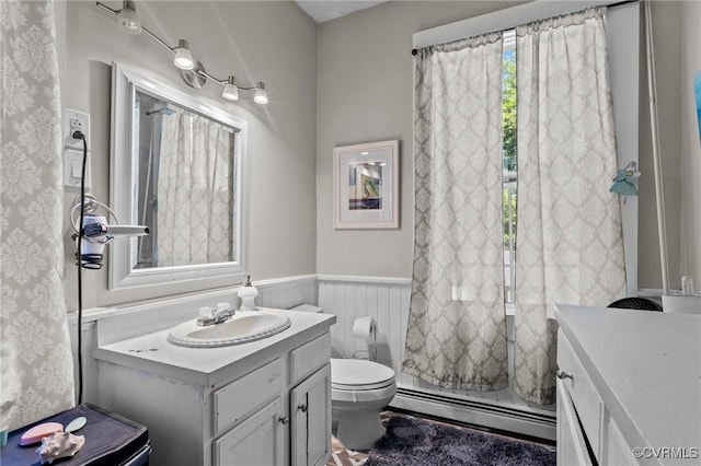 306 Hamilton Ave, Colonial Heights, VA 23834 - full bathroom featuring baseboard heating, vanity, wainscoting, and a shower