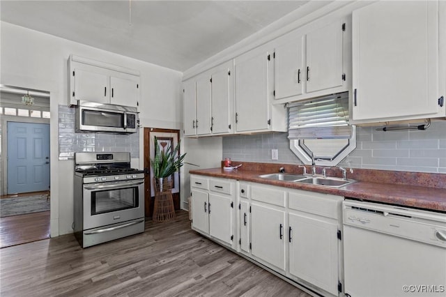 306 Hamilton Ave, Colonial Heights, VA 23834 - kitchen featuring appliances with stainless steel finishes, white cabinets, and decorative backsplash