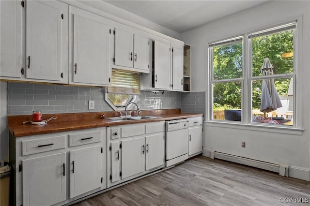 306 Hamilton Ave, Colonial Heights, VA 23834 - kitchen featuring white dishwasher, baseboard heating, white cabinets, decorative backsplash, and light wood-type flooring