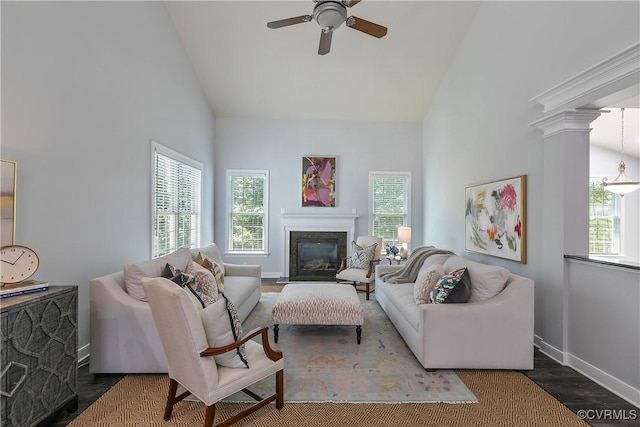 6430 Arwen Mews, Moseley, VA 23120 - living area with high vaulted ceiling, healthy amount of natural light, a ceiling fan, a fireplace with flush hearth, and wood finished floors