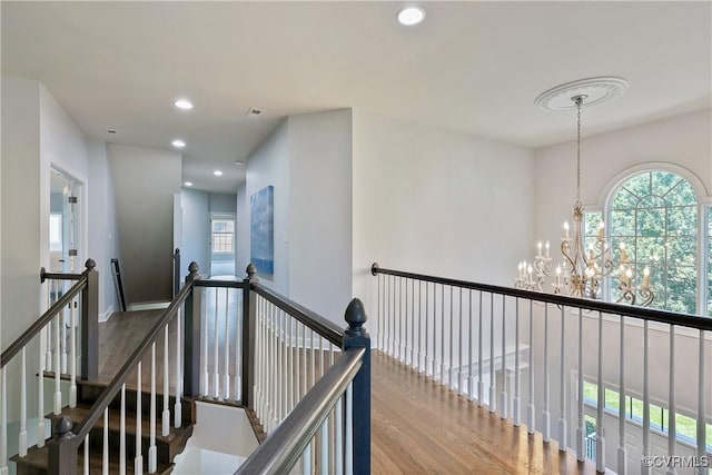 6430 Arwen Mews, Moseley, VA 23120 - hall featuring a chandelier, healthy amount of natural light, wood finished floors, recessed lighting, and an upstairs landing