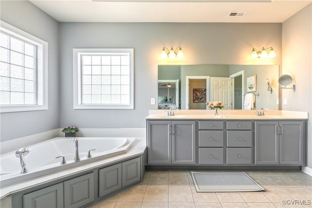 6430 Arwen Mews, Moseley, VA 23120 - bathroom with double vanity, a bath, and tile patterned flooring