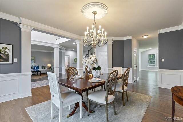 6430 Arwen Mews, Moseley, VA 23120 - dining room with ornate columns, dark wood-style floors, a wainscoted wall, crown molding, and a chandelier