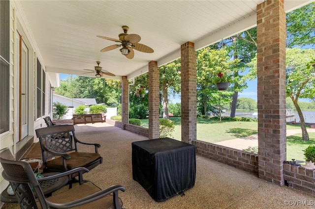 716 W Riverside Dr, Lanexa, VA 23089 - view of patio with a ceiling fan and a water view