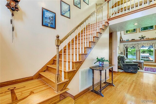 716 W Riverside Dr, Lanexa, VA 23089 - stairs with wood finished floors and a towering ceiling