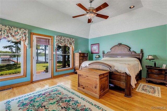 716 W Riverside Dr, Lanexa, VA 23089 - bedroom featuring access to outside, wood finished floors, vaulted ceiling, and a ceiling fan