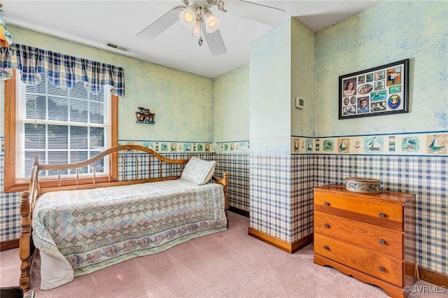 716 W Riverside Dr, Lanexa, VA 23089 - carpeted bedroom with a wainscoted wall and ceiling fan