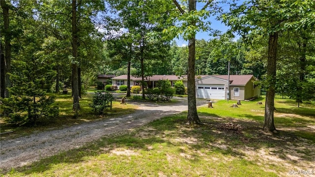 454 Elam Forest Dr, Prospect, VA 23960 - ranch-style house featuring a front lawn, dirt driveway, and view of scattered trees
