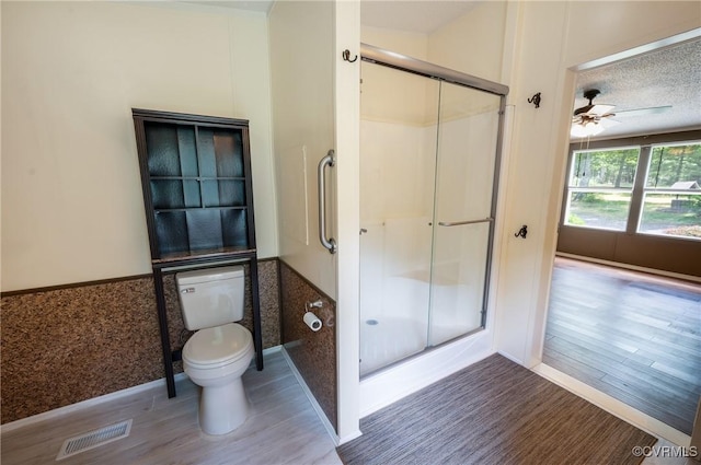 454 Elam Forest Dr, Prospect, VA 23960 - full bath featuring wood finished floors, a wainscoted wall, a shower stall, and ceiling fan