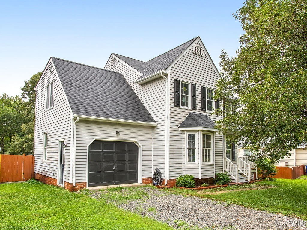 6184 Midnight Dr, Hanover, VA 23111 - view of front of property with driveway, roof with shingles, and an attached garage