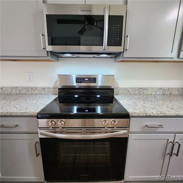 3104 Aqua Ct, Richmond, VA 23230 - kitchen with stainless steel appliances, a ceiling fan, and light stone countertops