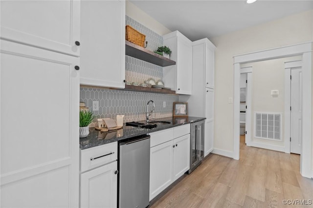 TBD Cedar Lane, Glen Allen, VA 23059 - kitchen with open shelves, tasteful backsplash, dishwashing machine, white cabinets, and dark stone countertops