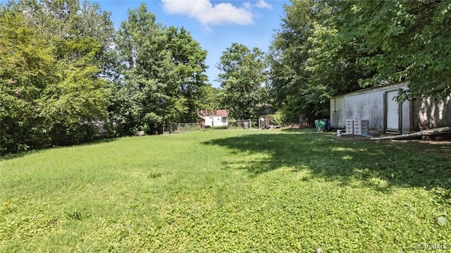 17 E 31st St, Richmond, VA 23224 - view of green lawn featuring an outbuilding and view of scattered trees