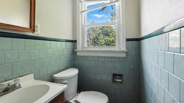 17 E 31st St, Richmond, VA 23224 - bathroom featuring tile walls, wainscoting, and vanity