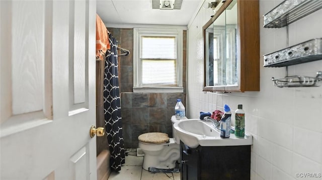 17 E 31st St, Richmond, VA 23224 - bathroom featuring tile walls, vanity, and tile patterned flooring