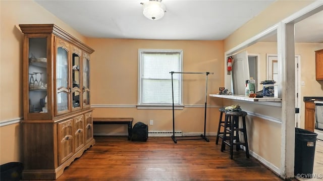 17 E 31st St, Richmond, VA 23224 - interior space featuring dark wood-type flooring and a baseboard heating unit