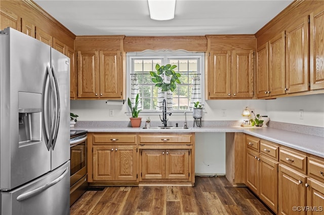 11501 Courthouse Rd, Dinwiddie, VA 23841 - kitchen featuring appliances with stainless steel finishes, light countertops, dark wood-type flooring, and brown cabinets