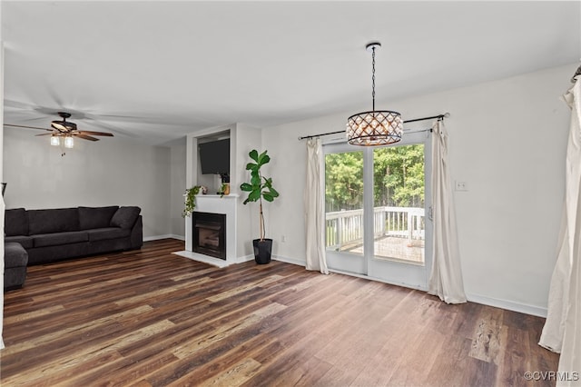 11501 Courthouse Rd, Dinwiddie, VA 23841 - unfurnished living room featuring wood finished floors, a fireplace with flush hearth, and a ceiling fan
