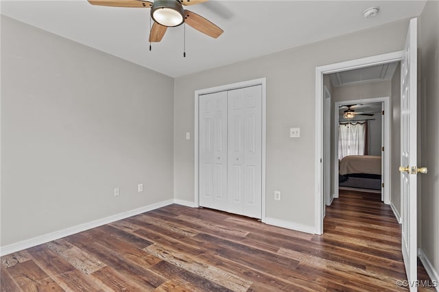 11501 Courthouse Rd, Dinwiddie, VA 23841 - unfurnished bedroom with attic access, dark wood-type flooring, a closet, and ceiling fan