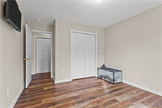 11501 Courthouse Rd, Dinwiddie, VA 23841 - unfurnished bedroom featuring wood finished floors and a closet