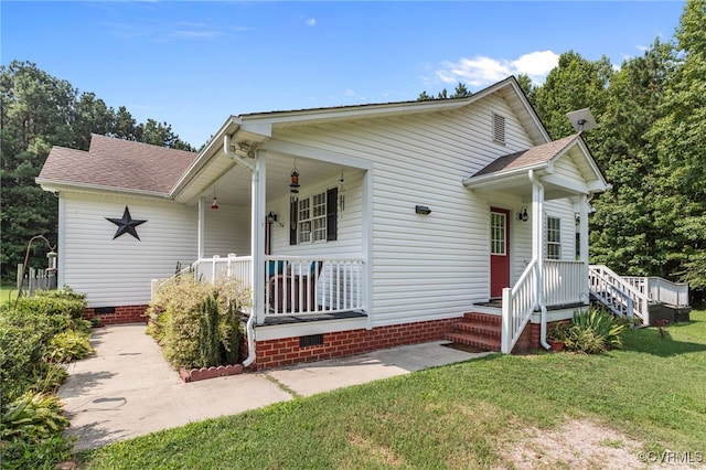 11501 Courthouse Rd, Dinwiddie, VA 23841 - view of front facade with crawl space, a front yard, covered porch, and roof with shingles