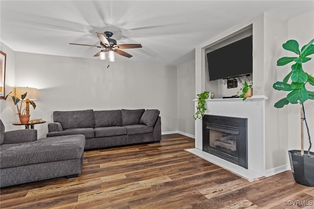 11501 Courthouse Rd, Dinwiddie, VA 23841 - living area with wood finished floors, a ceiling fan, and a fireplace with flush hearth