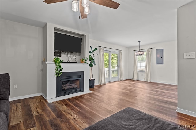 11501 Courthouse Rd, Dinwiddie, VA 23841 - unfurnished living room featuring a fireplace, wood finished floors, a ceiling fan, and electric panel