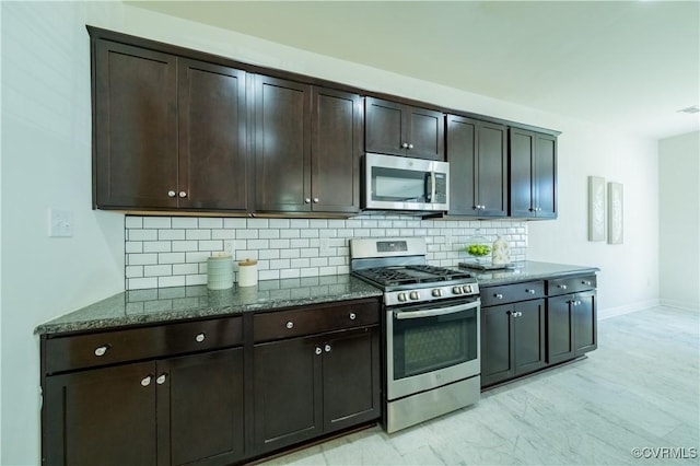 5311 Benmable Ct, Glen Allen, VA 23059 - kitchen with appliances with stainless steel finishes, dark stone countertops, tasteful backsplash, and dark brown cabinetry