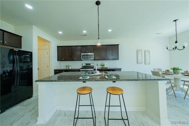 5311 Benmable Ct, Glen Allen, VA 23059 - kitchen with appliances with stainless steel finishes, light marble finish floors, dark brown cabinets, a chandelier, and backsplash