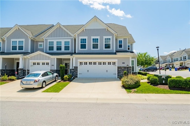 5311 Benmable Ct, Glen Allen, VA 23059 - view of front of house with board and batten siding, concrete driveway, an attached garage, and stone siding