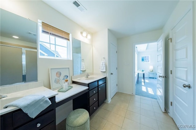 5311 Benmable Ct, Glen Allen, VA 23059 - full bathroom with two vanities, tile patterned flooring, and a stall shower