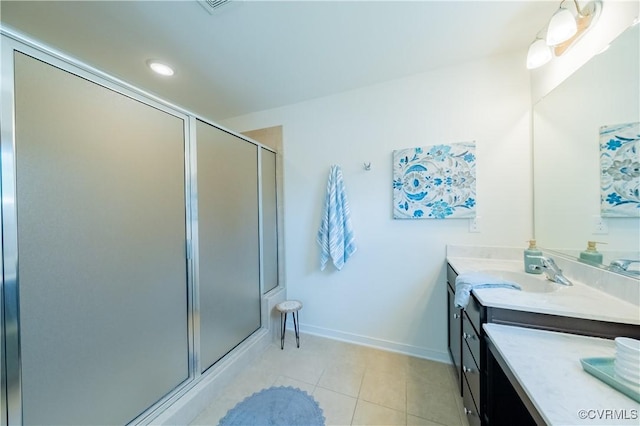 5311 Benmable Ct, Glen Allen, VA 23059 - bathroom featuring vanity, a stall shower, tile patterned flooring, and recessed lighting