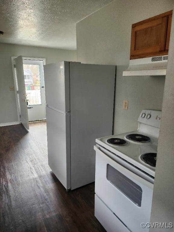 137 Virginia Ave, Petersburg, VA 23803 - kitchen with white appliances, under cabinet range hood, dark wood-type flooring, brown cabinets, and a textured ceiling