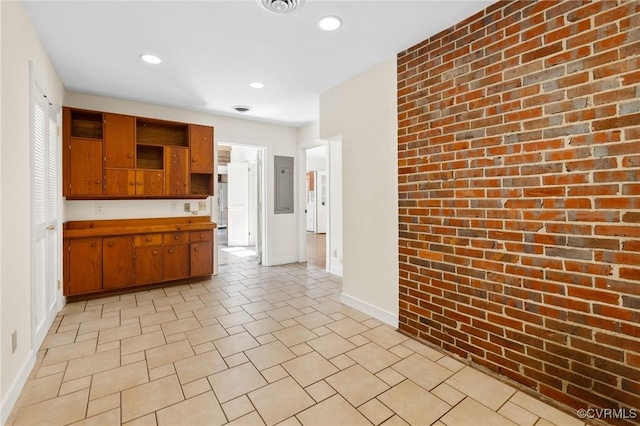 7800 Wood Rd, Henrico, VA 23229 - kitchen featuring open shelves, brick wall, brown cabinets, recessed lighting, and light countertops
